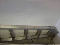 Side rails and rungs of aluminum ladder