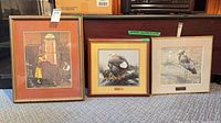 Three framed prints: Rockwell interior scene, Bateman bald eagle, wildlife bird print