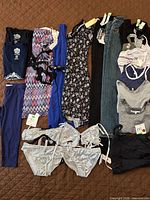 Full layout of 17 clothing items showing variety and condition