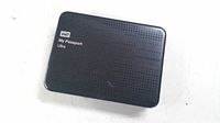 Front view showing WD My Passport Ultra branding and perforated surface