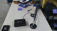 SenseCAP gateway and Nebra antenna with cable on table