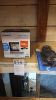 Retail box and sealed accessory kit on shelf