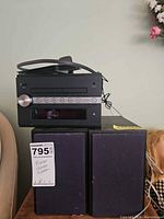 Front view of receiver sitting on two speakers