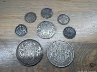 All eight coins front side view