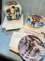 Three collector plates with certificates, boxes and single plate stand