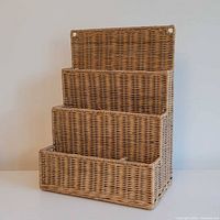 Front view of four-tier wicker organizer