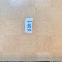 Close view of veneer square pattern top with lot sticker
