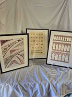 All three framed prints standing side by side