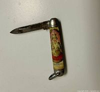Knife open showing coronation graphic side