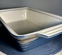 Front angled view showing blue exterior and white interior
