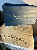 Blue stained Ripe al Convento crate resting on Nickel & Nickel hinged-lid crate