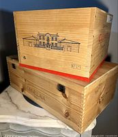 Stacked view of both crates showing logos and relative sizes