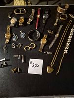 overview of entire mixed jewelry lot displayed on black surface