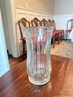 Oblique view of full vase showing ribbed body and overall shape