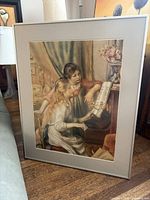 Front view of framed print showing subject, frame, mat