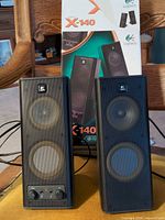 Front view of both speakers and box