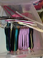 Open tote showing assorted hangers neatly stacked