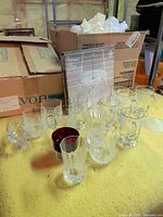 Overview of assorted glassware and boxed server on table