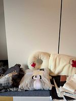 Lot overview showing pajamas set, neck rest, throw blanket and cushion covers