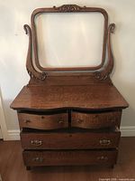 Front view of oak wash stand showing mirror frame and drawers