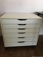 Front view of white 6-drawer cabinet on wheels