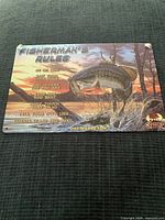 Front view of metal wall sign showing full artwork and branding