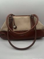 Front view of Liz Claiborne canvas and leather satchel showing overall style and dual handles