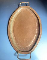 Full view of hammered copper oval tray with handles