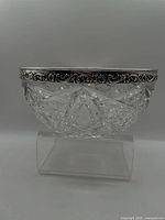 Full view of cut crystal bowl with sterling silver rim