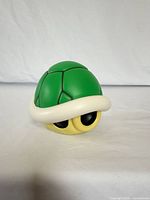 Front three-quarter view of the green shell light