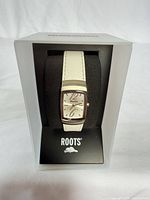 Front view showing watch face, band and box