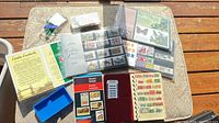 Overview of all stamp items: albums, sealed packs, wallet, tray