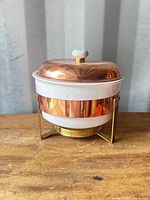 Full chafing dish assembled showing copper lid, milk glass, brass stand