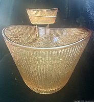 Large amber textured bowl with small bowl on stand inside