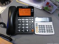 AT&T corded phone and Canon calculator side by side