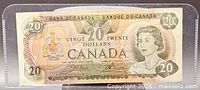 Obverse of 1979 Canadian $20 note in sleeve, showing Queen Elizabeth II and denomination
