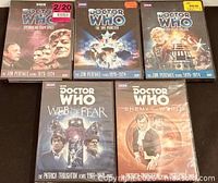 Front covers of all five sealed Doctor Who DVDs