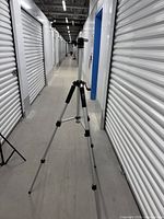 Tripod fully extended in hallway showing overall structure and height