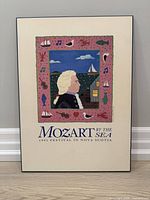 Front view of framed poster showing full artwork and text