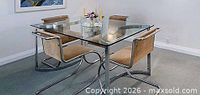 full view of glass dining table with four chairs around it