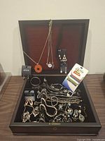 Overall view of open jewelry box with contents