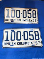 Both 1957 BC plates front view showing numbers and condition