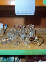 Shelf with full grouping of crystal and glass items