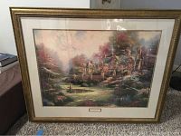 Full view of the framed print showing the scenic landscape under glass.