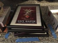 Stack of framed French advertising print reproductions with visible print 'Café Martin Eugene Martin 33 Rue Joubert, Paris'