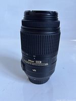Full view of Nikon AF-S 55-300mm lens standing upright