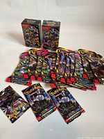 Group shot of two booster boxes and spread of opened booster packs