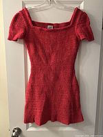 Front view of red knit mini dress on hanger