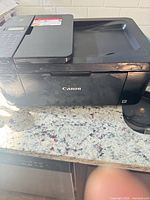 Front and side view of Canon Pixma multifunction printer