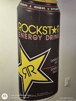 Full view of the Rockstar Energy Drink can cutout hanging on wall